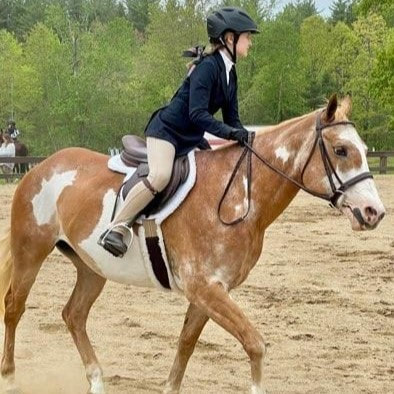 student competing at a horse show 