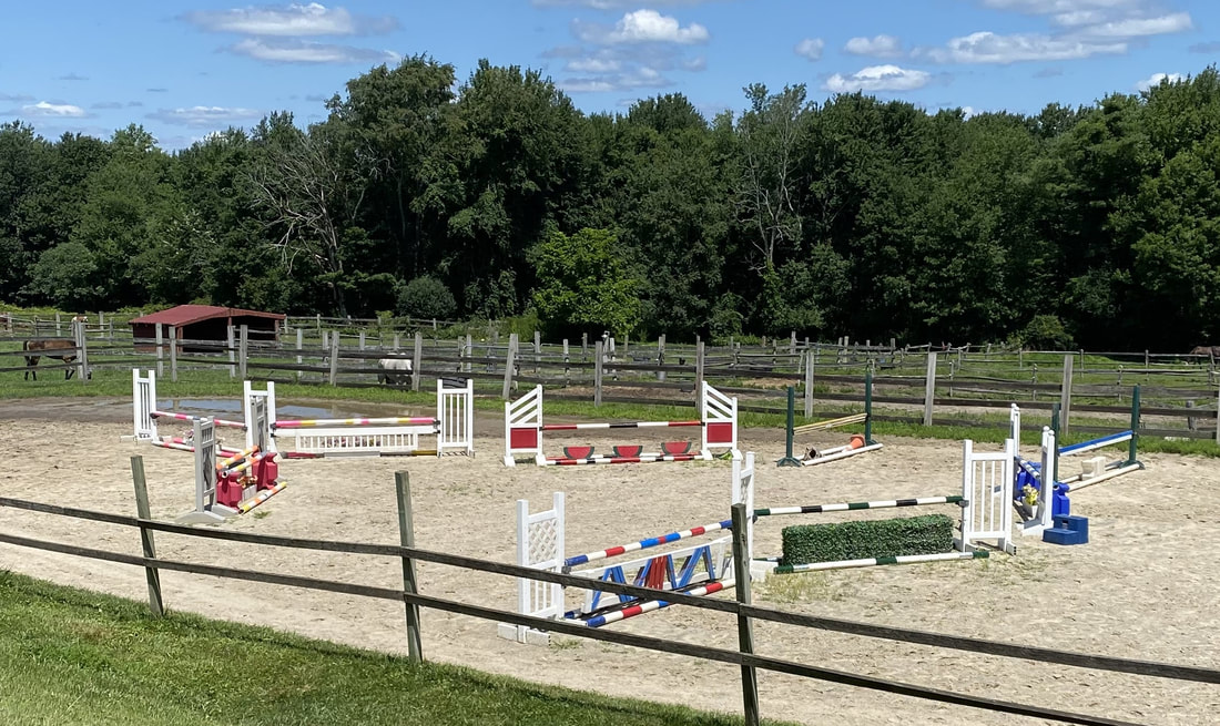 horseback riders in an apple orchard